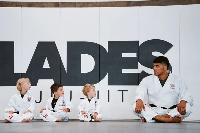 TFI instructor seated with children